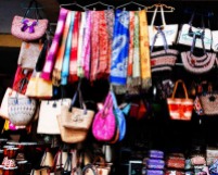 Colourful fabrics hang outside Ubud market (c) Clarice Fong